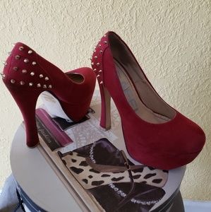 Red suede pumps